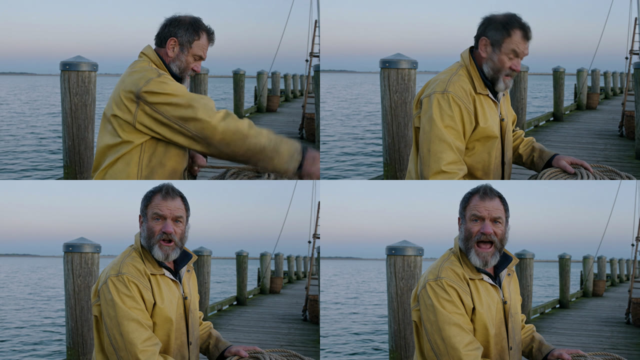 Prompt 3 frames: a bearded fisherman in a yellow oilskin coils rope on a dock, then looks up and speaks to the camera